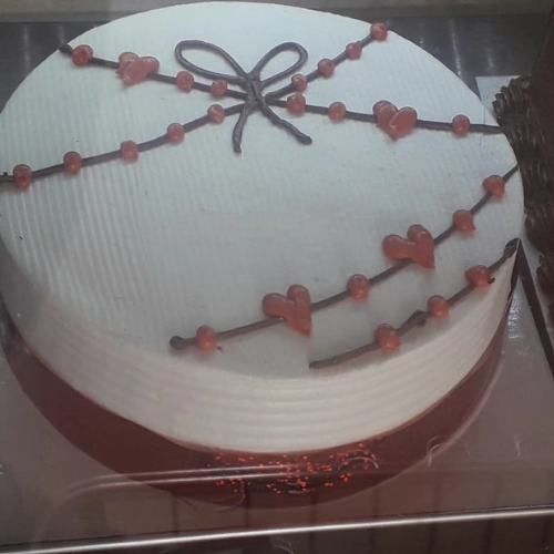 Brown Heart Buttercream Cake Add a touch of rustic charm to your celebration with a Brown Heart Buttercream Cake. This cake features a heart-shaped design and is adorned with delicate buttercream frosting, giving it a simple yet elegant look. With its warm brown hue and homemade appeal, this cake is perfect for any occasion, from birthdays to weddings. Made with quality ingredients and baked to perfection, this cake is as delicious as it is beautiful. Bring a little rustic elegance to your celebration with a Brown Heart Buttercream Cake that's sure to impress.